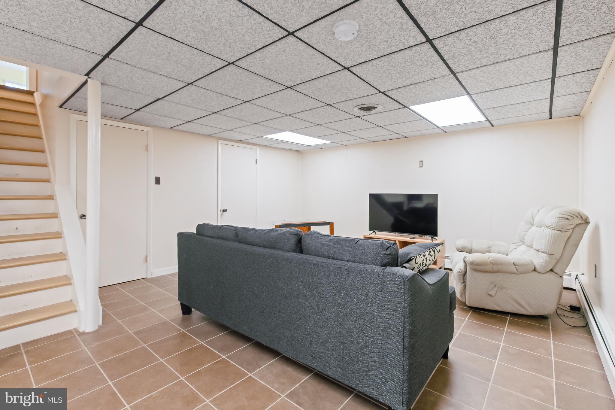 1749 Ramich Road Temple, PA 19560 - Photo 33 of 48 a living room with furniture and a flat screen tv