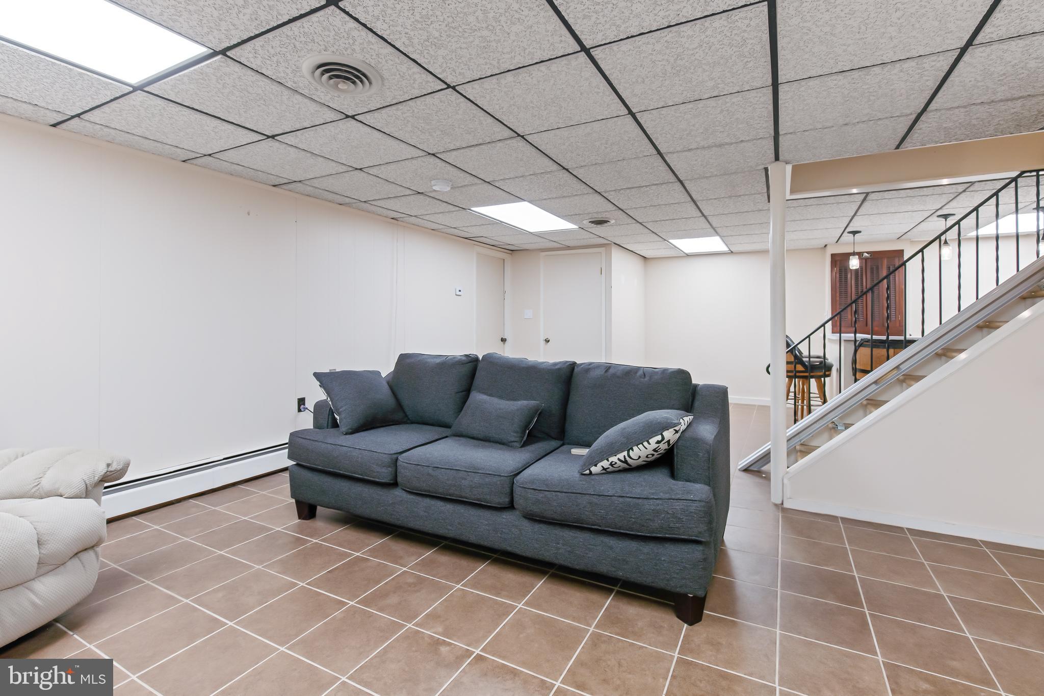 1749 Ramich Road Temple, PA 19560 - Photo 34 of 48 a living room with furniture and a ceiling fan
