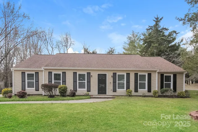 front view of a house with a garden