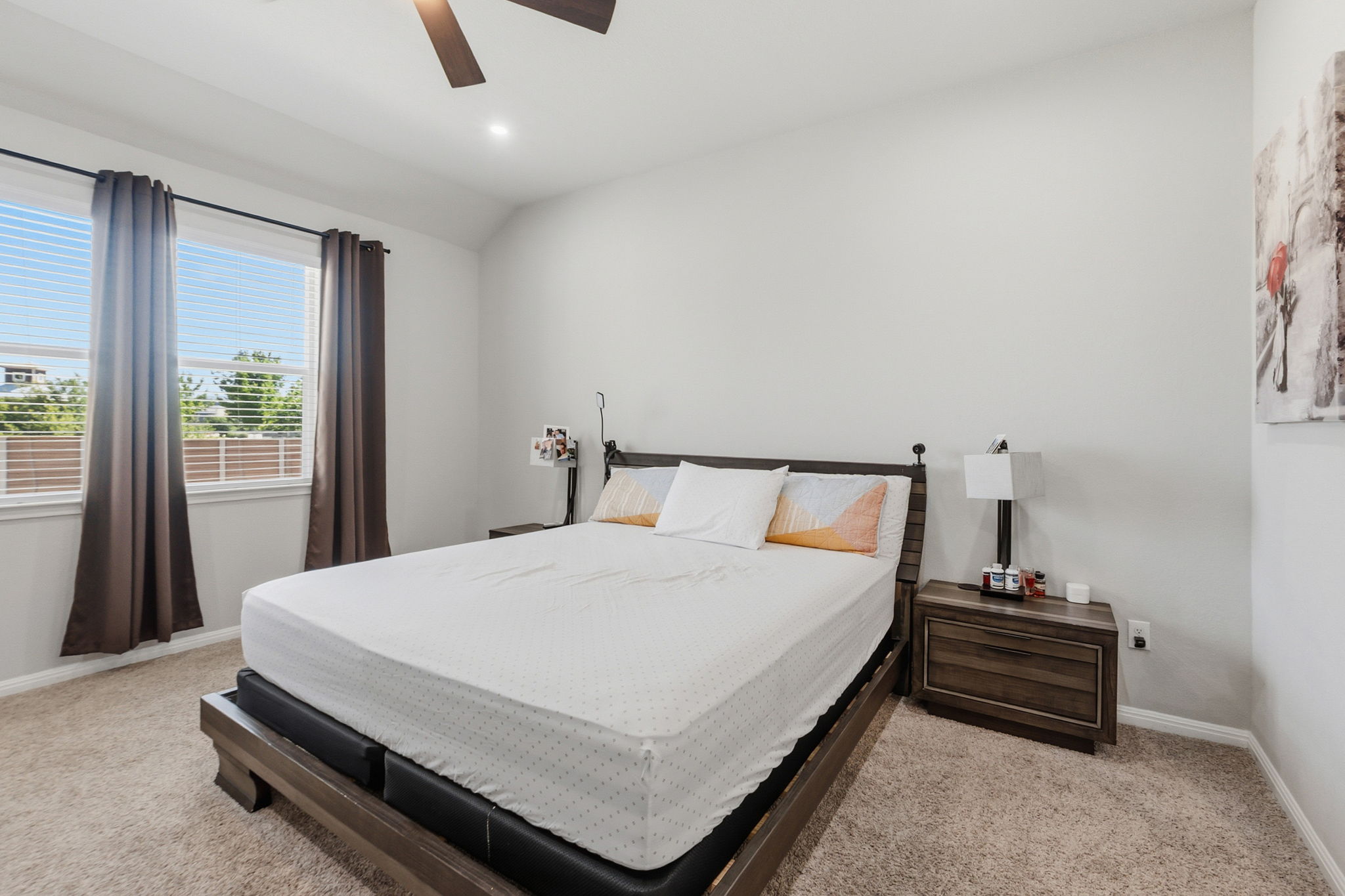 142 Brunnen Way Georgetown, TX 78626 - Photo 12 of 22 Comfortable carpeted bedroom with large window offering natural light.