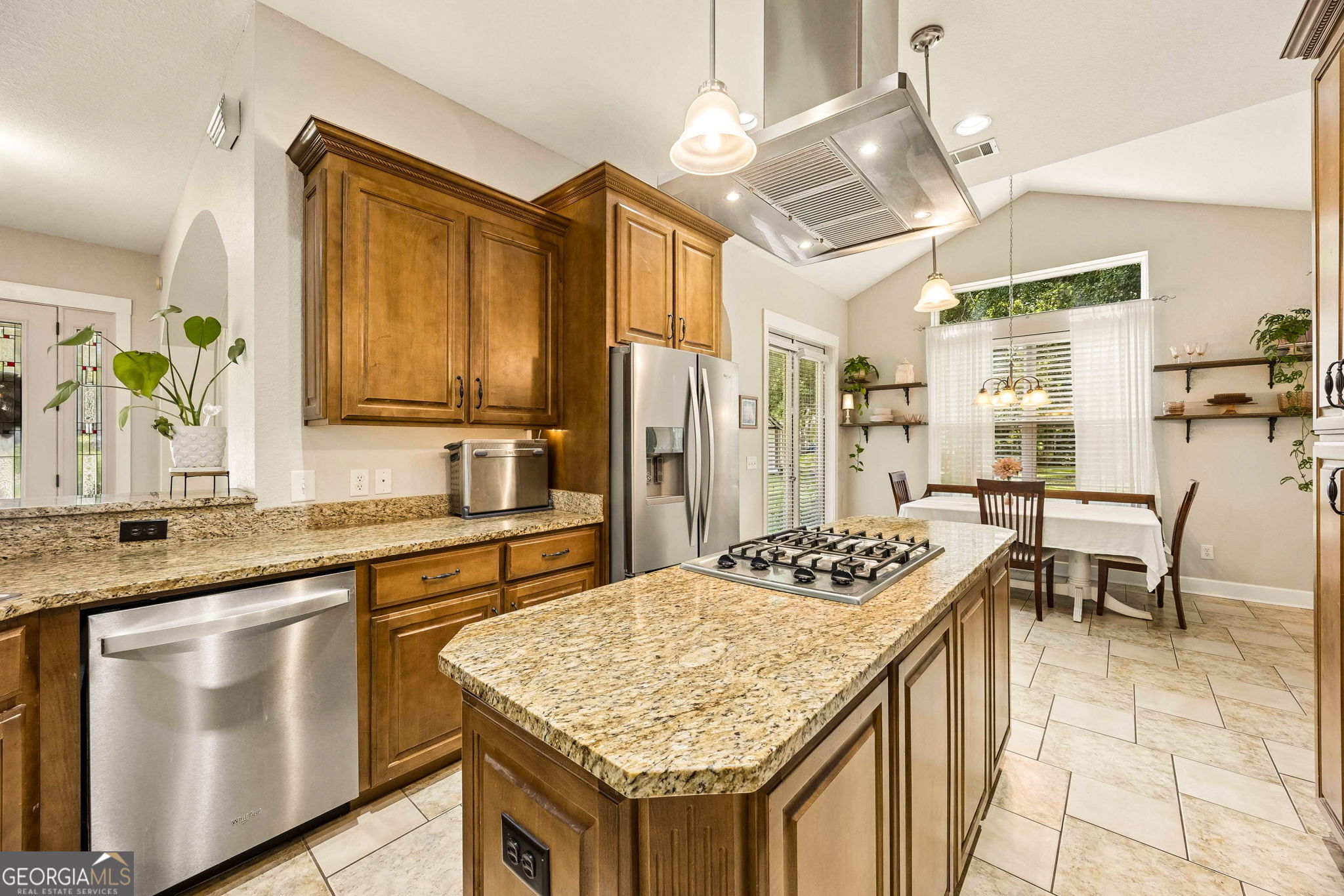 706 Hopewell Point Road White Oak, GA 31568 - Photo 18 of 84 The oversized island provides additional prep space and seating opportunities while maintaining a seamless connection to the sunny breakfast area.