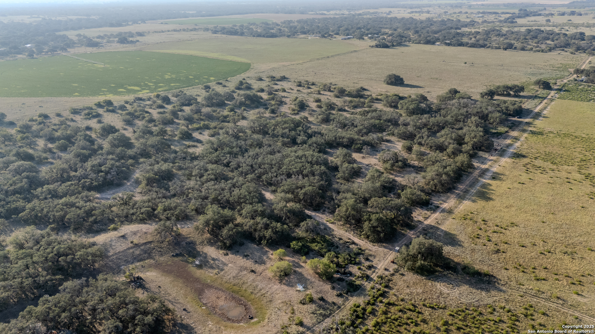 0 County Road 777 Devine, TX 78016 - Photo 4 of 8 a view of a lake from a yard