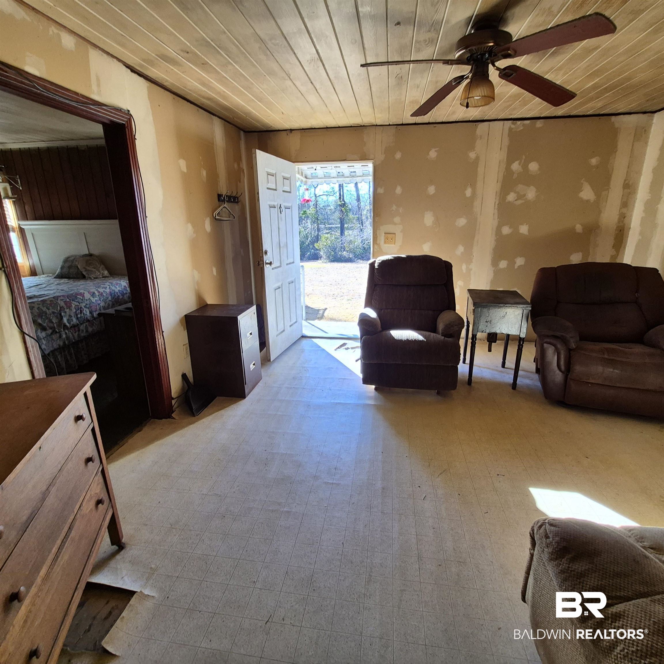 320 Bruner Avenue Evergreen, AL 36401 - Photo 2 of 15 Living room with wood ceiling and ceiling fan