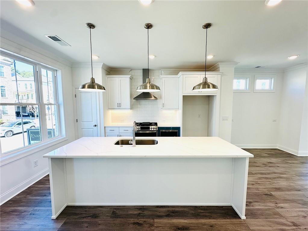 3187 Moor View Road, Unit 37 Duluth, GA 30096 - Photo 1 of 1 a kitchen with kitchen island sink stove and refrigerator