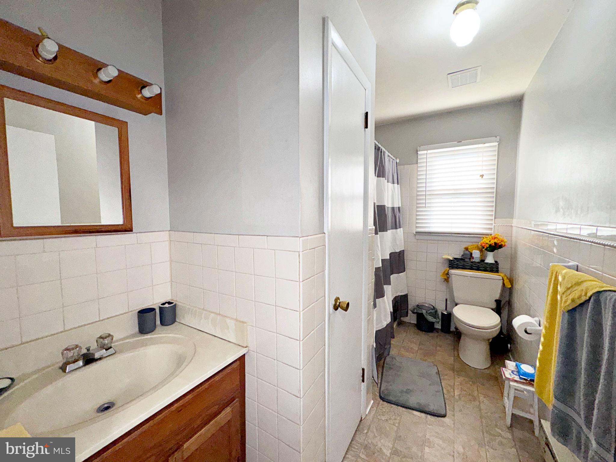 133 Lemon Road Ranson, WV 25438 - Photo 12 of 26 a bathroom with a sink mirror and toilet