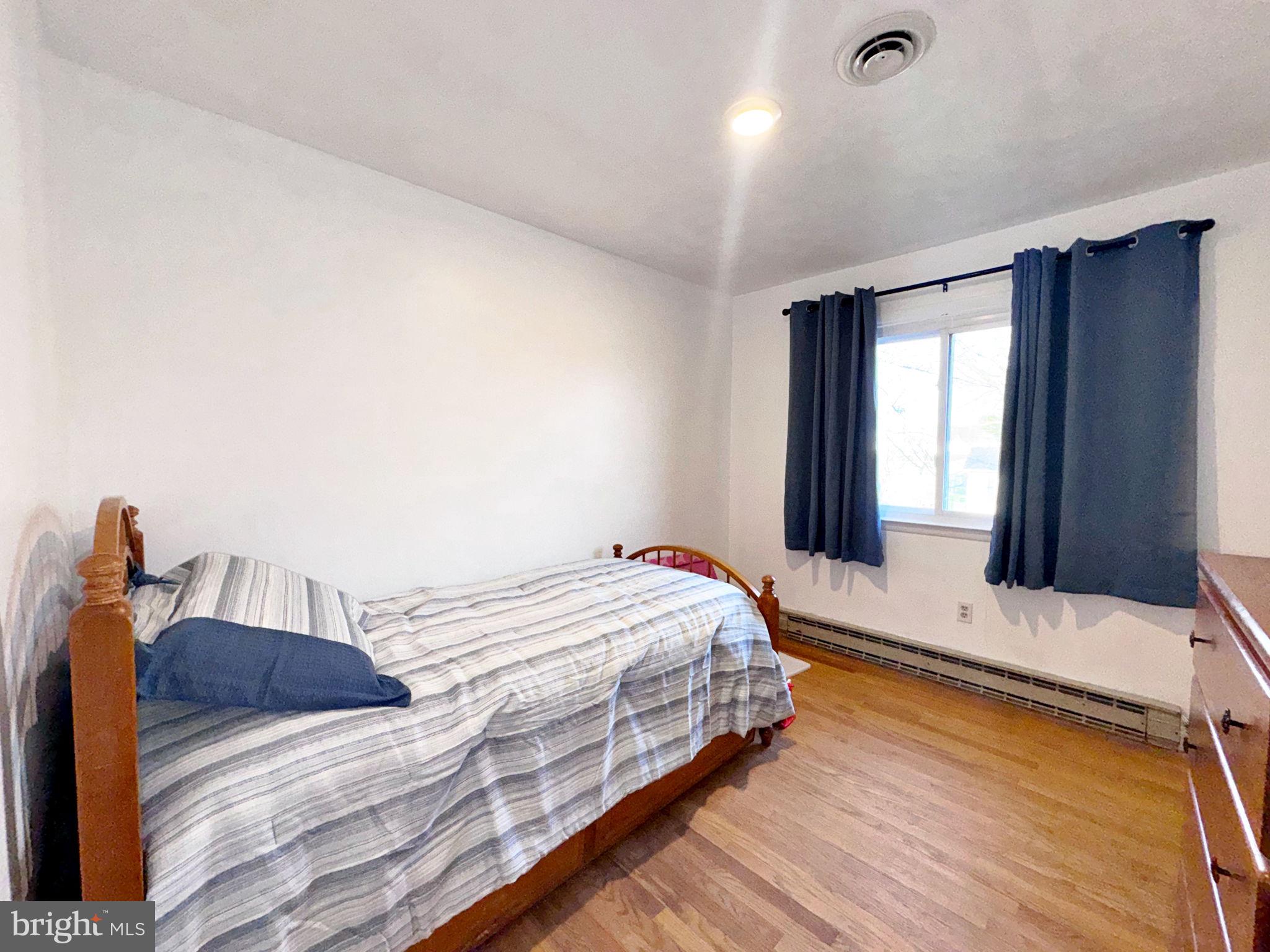 133 Lemon Road Ranson, WV 25438 - Photo 13 of 26 a bedroom with a bed and window