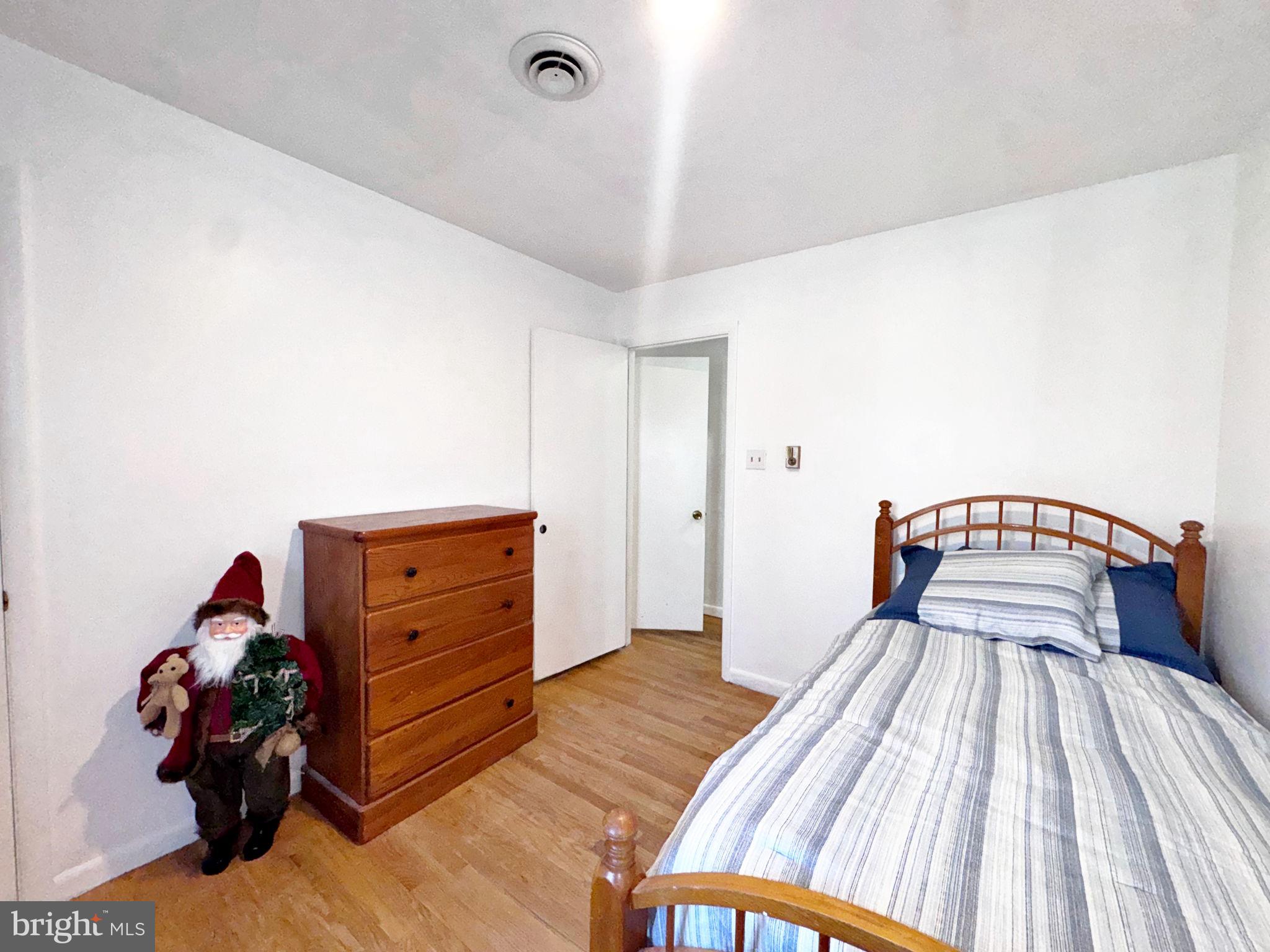 133 Lemon Road Ranson, WV 25438 - Photo 14 of 26 a bedroom with a bed and a dresser