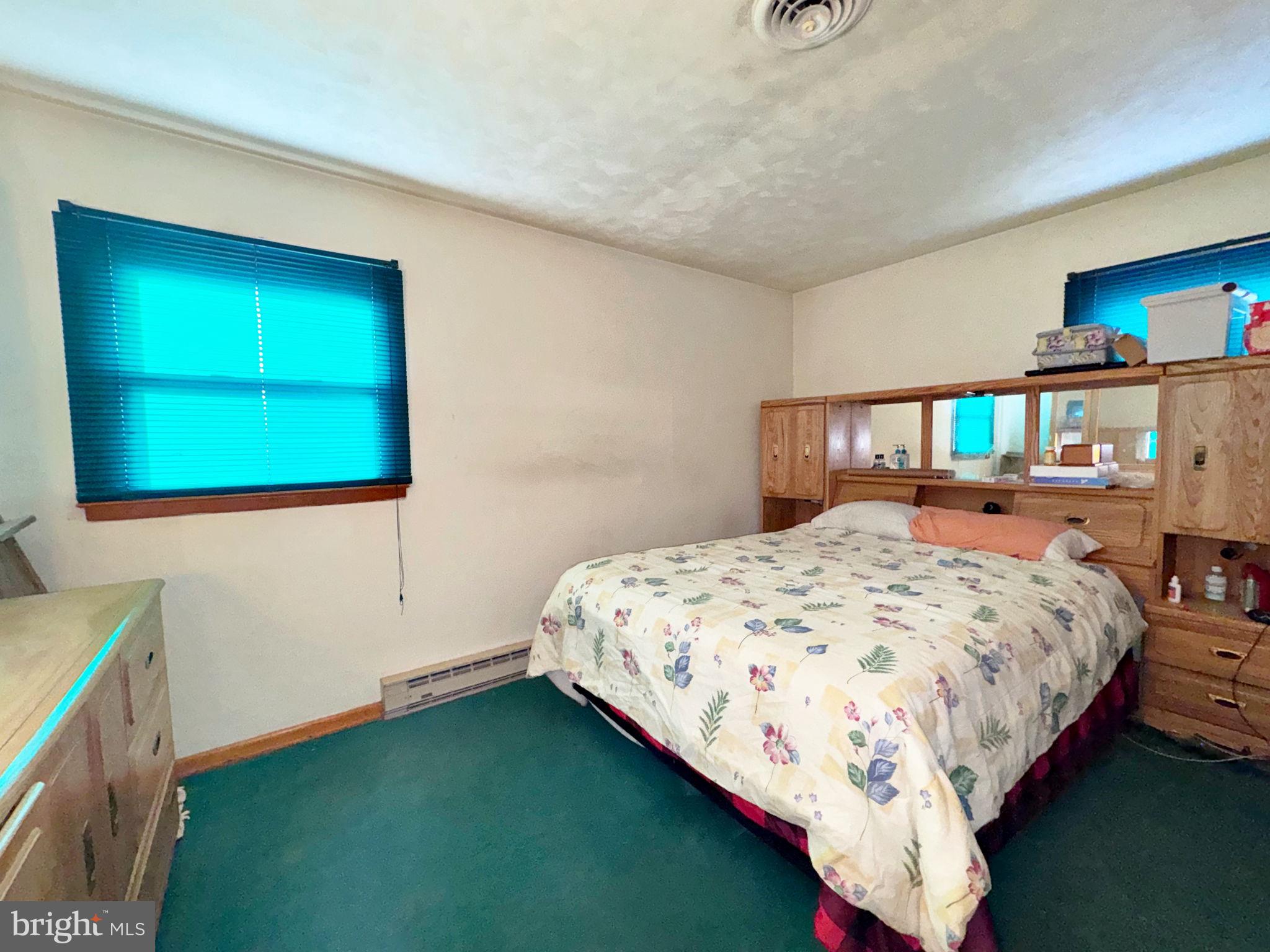 133 Lemon Road Ranson, WV 25438 - Photo 16 of 26 a bedroom with a bed and a dresser in it