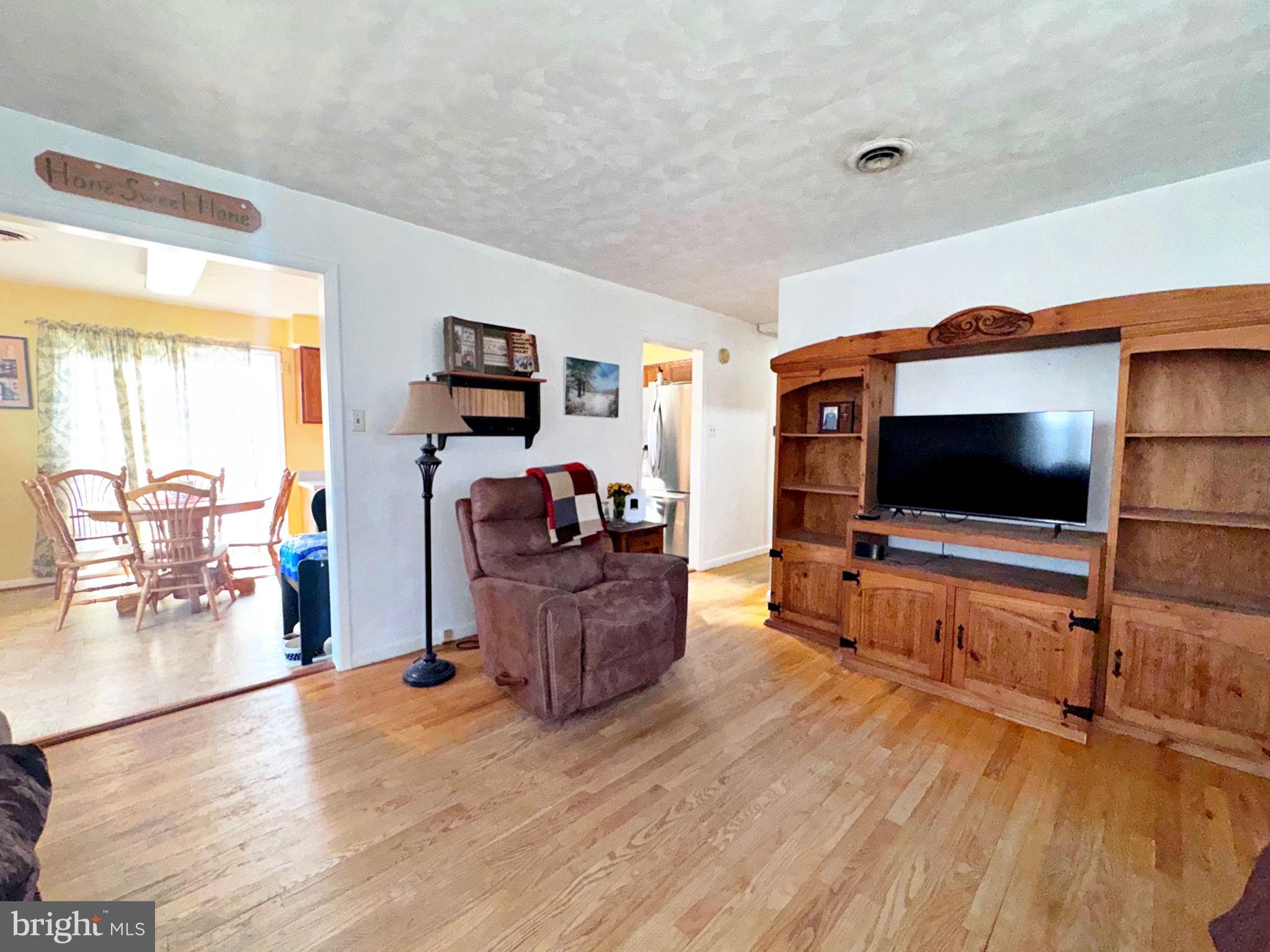 133 Lemon Road Ranson, WV 25438 - Photo 2 of 26 a living room with furniture and a flat screen tv