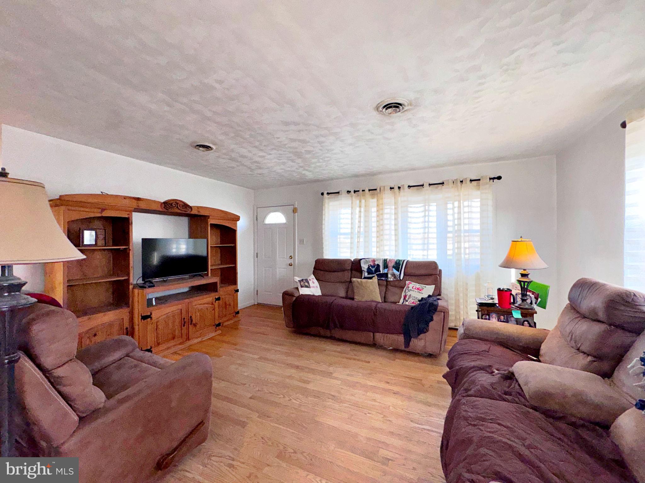 133 Lemon Road Ranson, WV 25438 - Photo 3 of 26 a living room with furniture and a flat screen tv