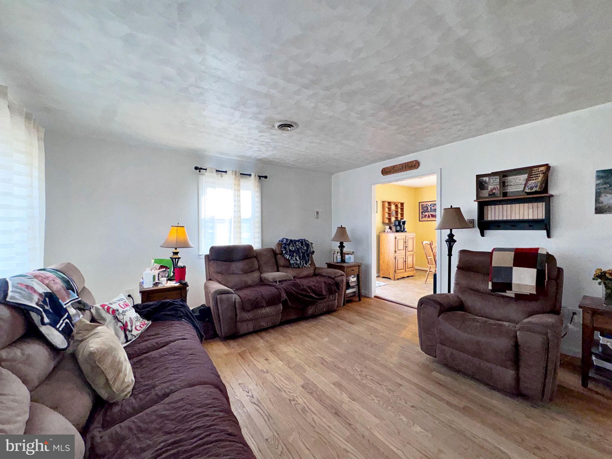 133 Lemon Road Ranson, WV 25438 - Photo 4 of 26 a living room with furniture and a wooden floor
