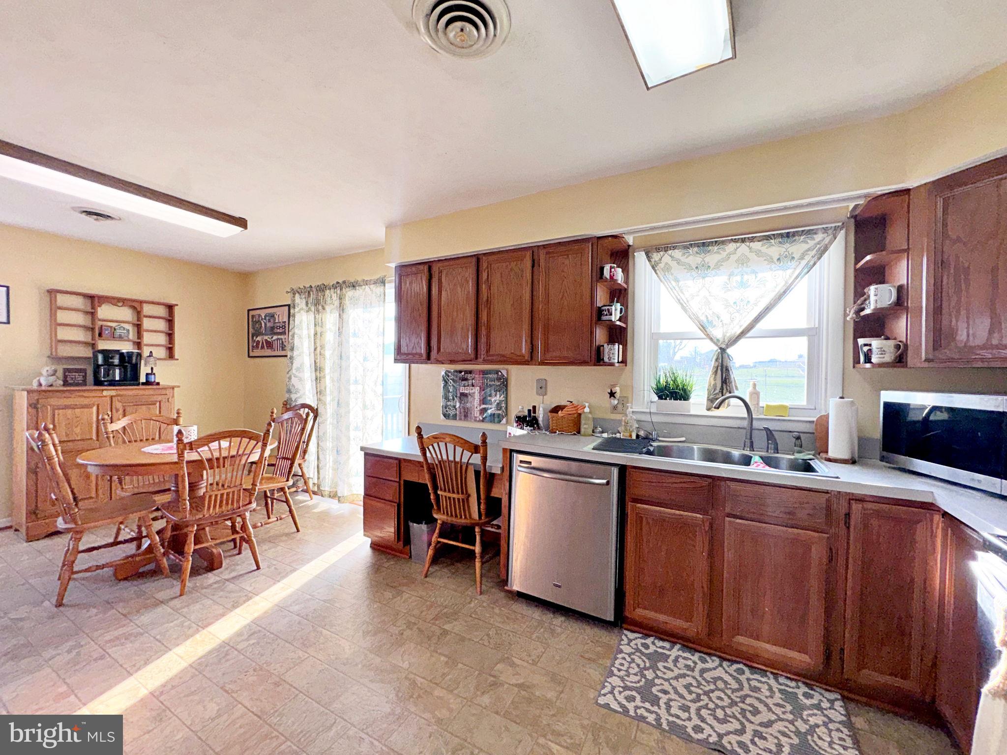 133 Lemon Road Ranson, WV 25438 - Photo 5 of 26 a kitchen with lots of counter top space and dining table