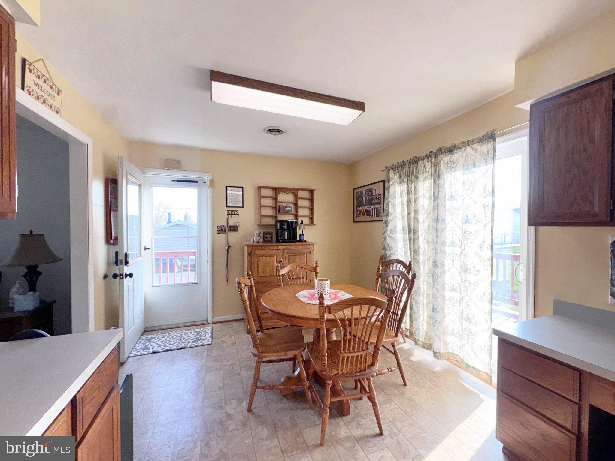133 Lemon Road Ranson, WV 25438 - Photo 7 of 26 a view of a dining room with furniture and window