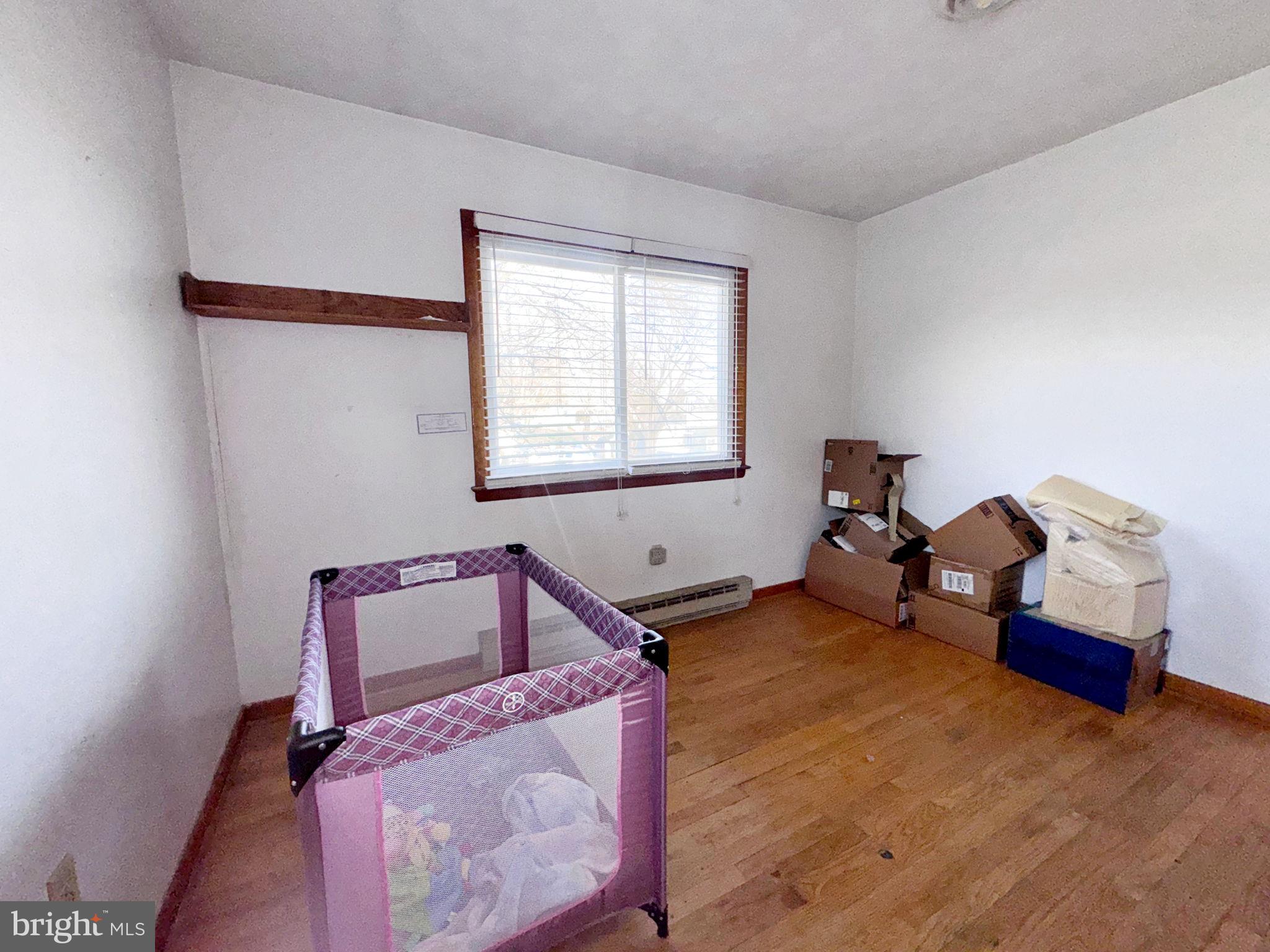 133 Lemon Road Ranson, WV 25438 - Photo 10 of 26 a bedroom with bed and window