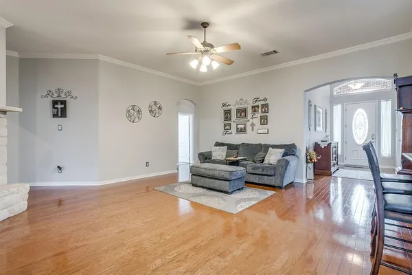 a living room with furniture and white walls