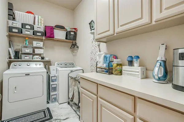 a view of kitchen and utility room with washer and dryer