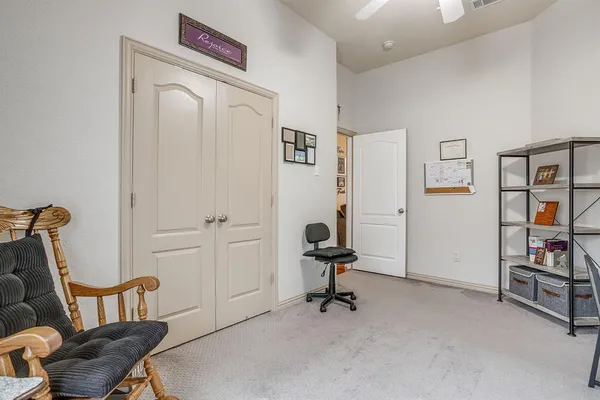 a view of a livingroom with workspace and a couch