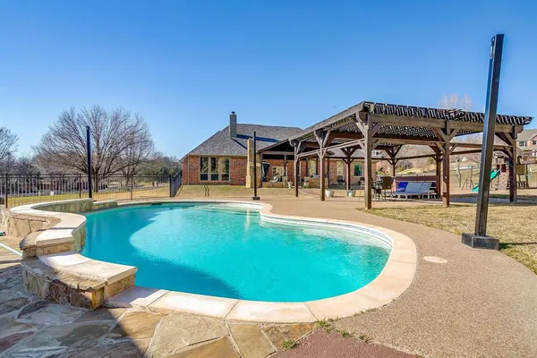 a view of a house with swimming pool