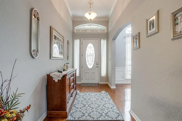 a view of an entryway with wooden floor