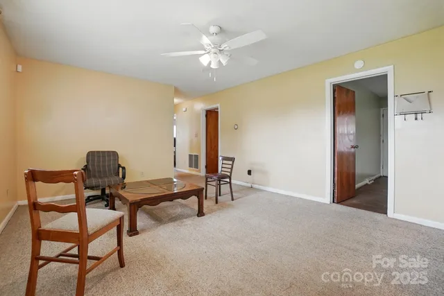 a view of a workspace with furniture