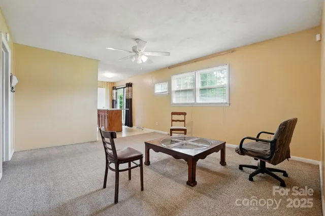 a work room with furniture and a window