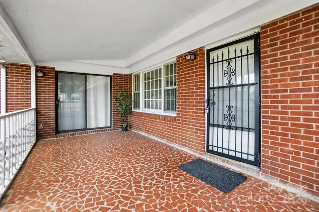 a view of a house with a wooden deck