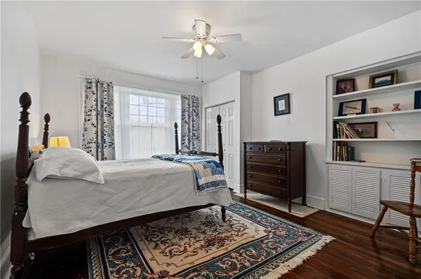 a bed room with a bed and a chandelier