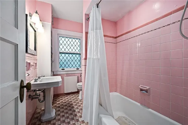 a bathroom with a bathtub sink and toilet