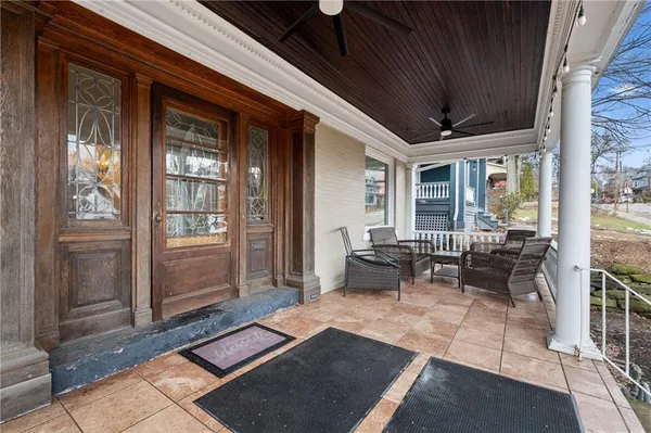 a outdoor space with patio area and glass door