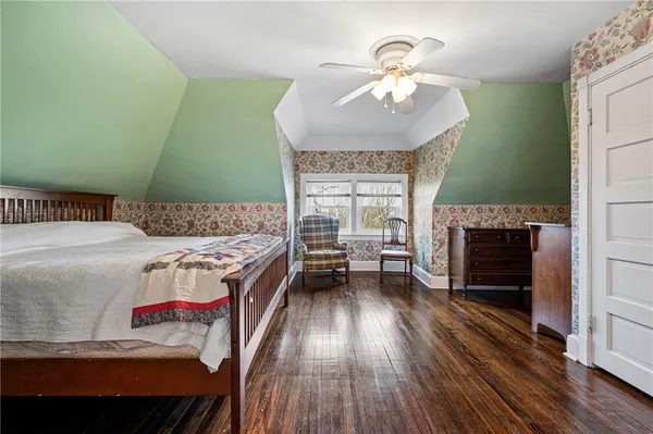 a bedroom with a bed and a fireplace