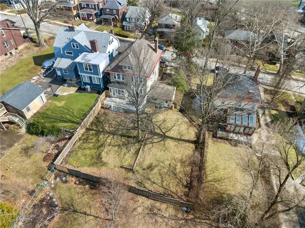 an aerial view of a house with yard swimming pool and outdoor seating