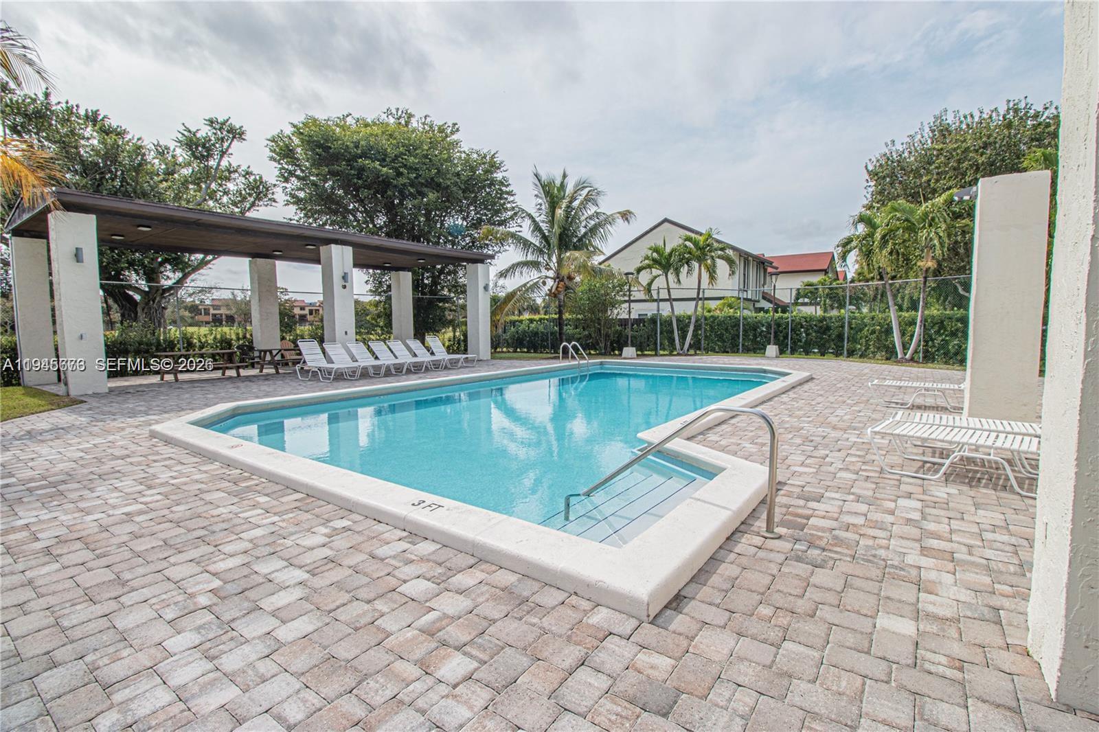 10099 Northwest 4th Lane, Unit 39 Miami, FL 33172 - Photo 15 of 16 a view of a house with a swimming pool
