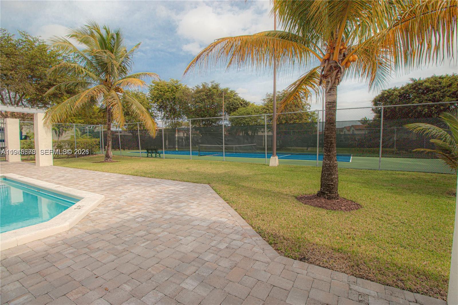 10099 Northwest 4th Lane, Unit 39 Miami, FL 33172 - Photo 16 of 16 a view of a park with palm trees