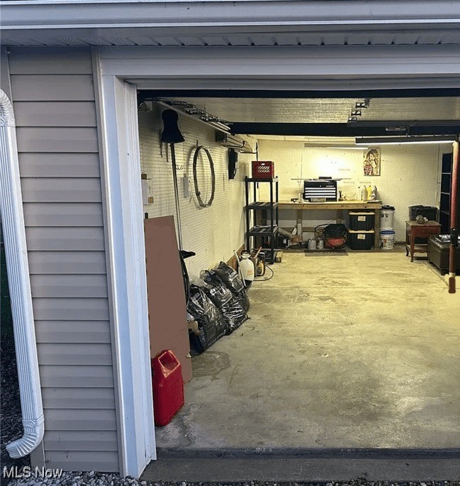 558 Frost Road Streetsboro, OH 44241 - Photo 31 of 32 Garage featuring a workshop area