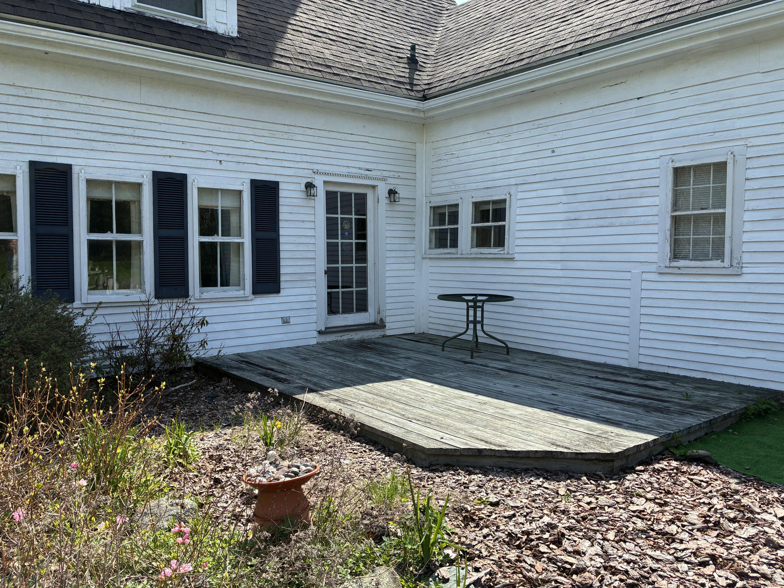 707 Newbury Neck Road Surry, ME 04684 - Photo 40 of 40 Back deck & patio from dining room.