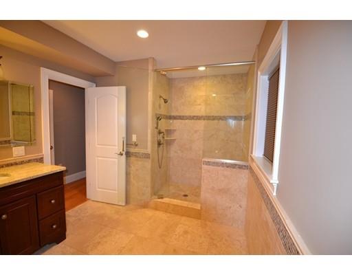 3 Stonefield Circle Winchester, MA 01890 - Photo 11 of 25 a bathroom with a granite countertop sink a shower and a mirror