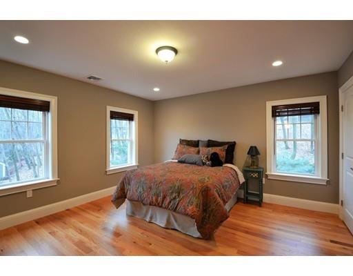 3 Stonefield Circle Winchester, MA 01890 - Photo 12 of 25 a bedroom with a bed and wooden floor