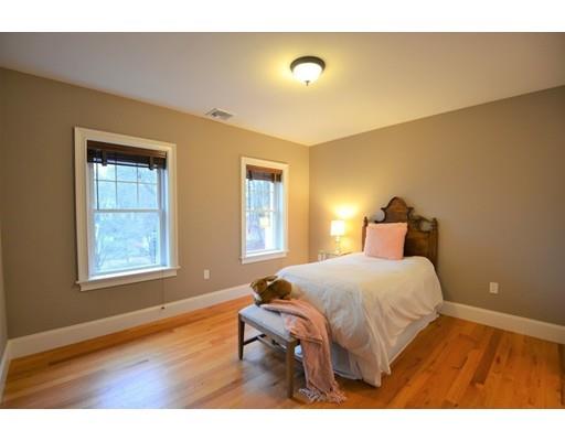 3 Stonefield Circle Winchester, MA 01890 - Photo 13 of 25 a bedroom with a bed and wooden floor