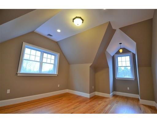 3 Stonefield Circle Winchester, MA 01890 - Photo 16 of 25 an empty room with wooden floor and windows