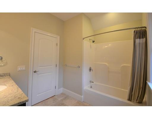 3 Stonefield Circle Winchester, MA 01890 - Photo 19 of 25 a bathroom with a tub and shower