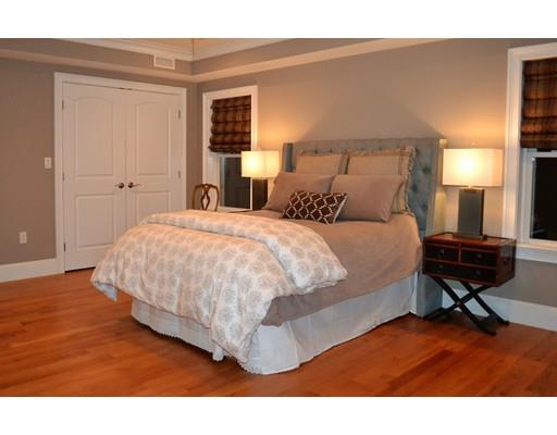 3 Stonefield Circle Winchester, MA 01890 - Photo 9 of 25 a bedroom with a bed a table and chair