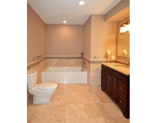 3 Stonefield Circle Winchester, MA 01890 - Photo 10 of 25 a bathroom with a granite countertop sink a toilet and bathtub