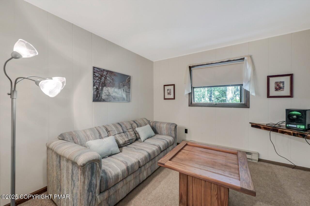 117 Winding Hill Road Pocono Pines, PA 18350 - Photo 11 of 19 a living room with furniture and a wooden floor