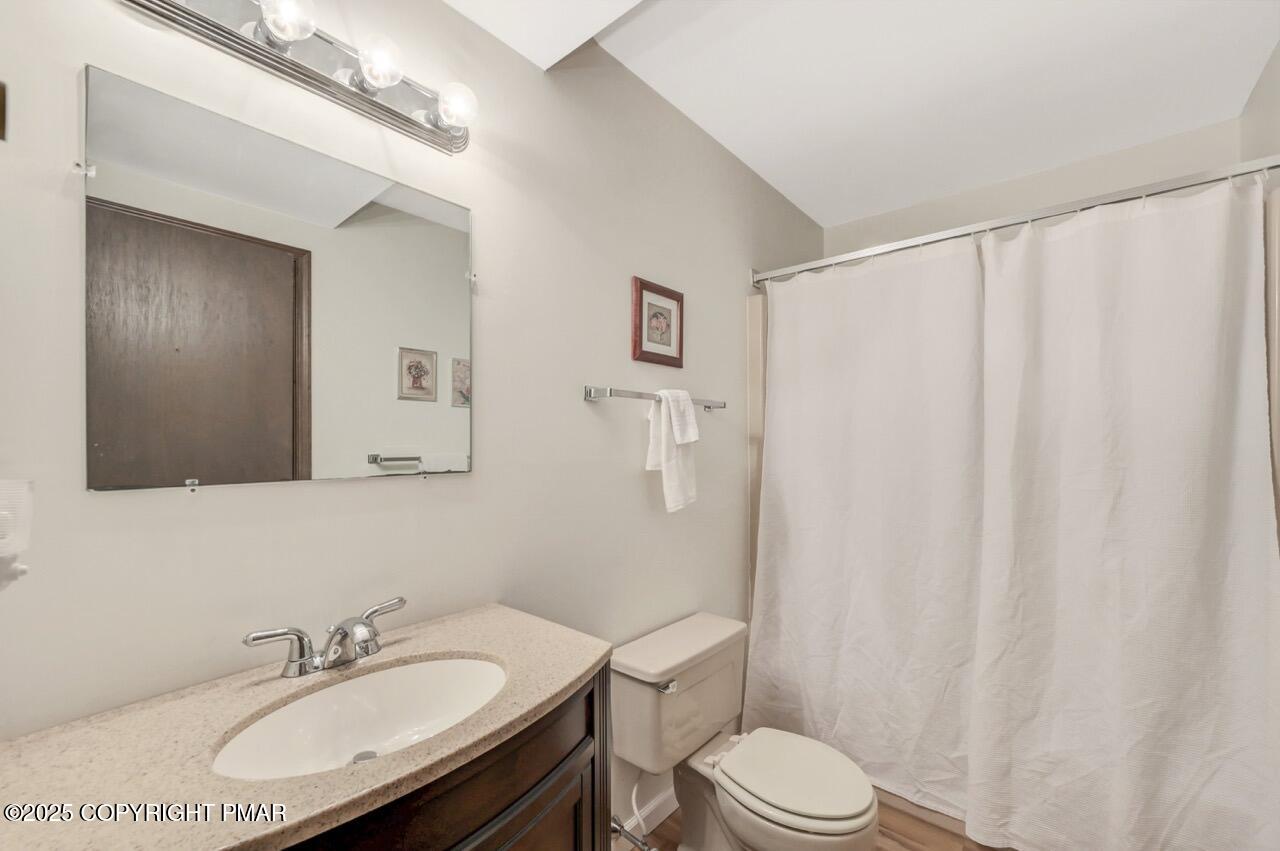 117 Winding Hill Road Pocono Pines, PA 18350 - Photo 13 of 19 a bathroom with a sink toilet and a mirror