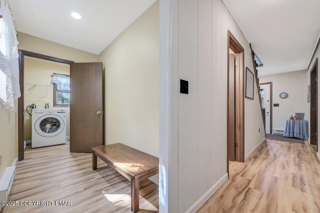 117 Winding Hill Road Pocono Pines, PA 18350 - Photo 15 of 19 a view of a hallway with bathroom and wooden floor
