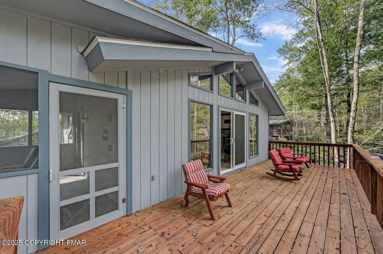 117 Winding Hill Road Pocono Pines, PA 18350 - Photo 18 of 19 a balcony with wooden floor and furniture