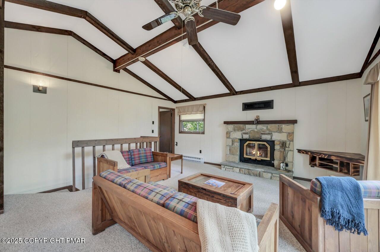 117 Winding Hill Road Pocono Pines, PA 18350 - Photo 3 of 19 a living room with furniture and a fireplace