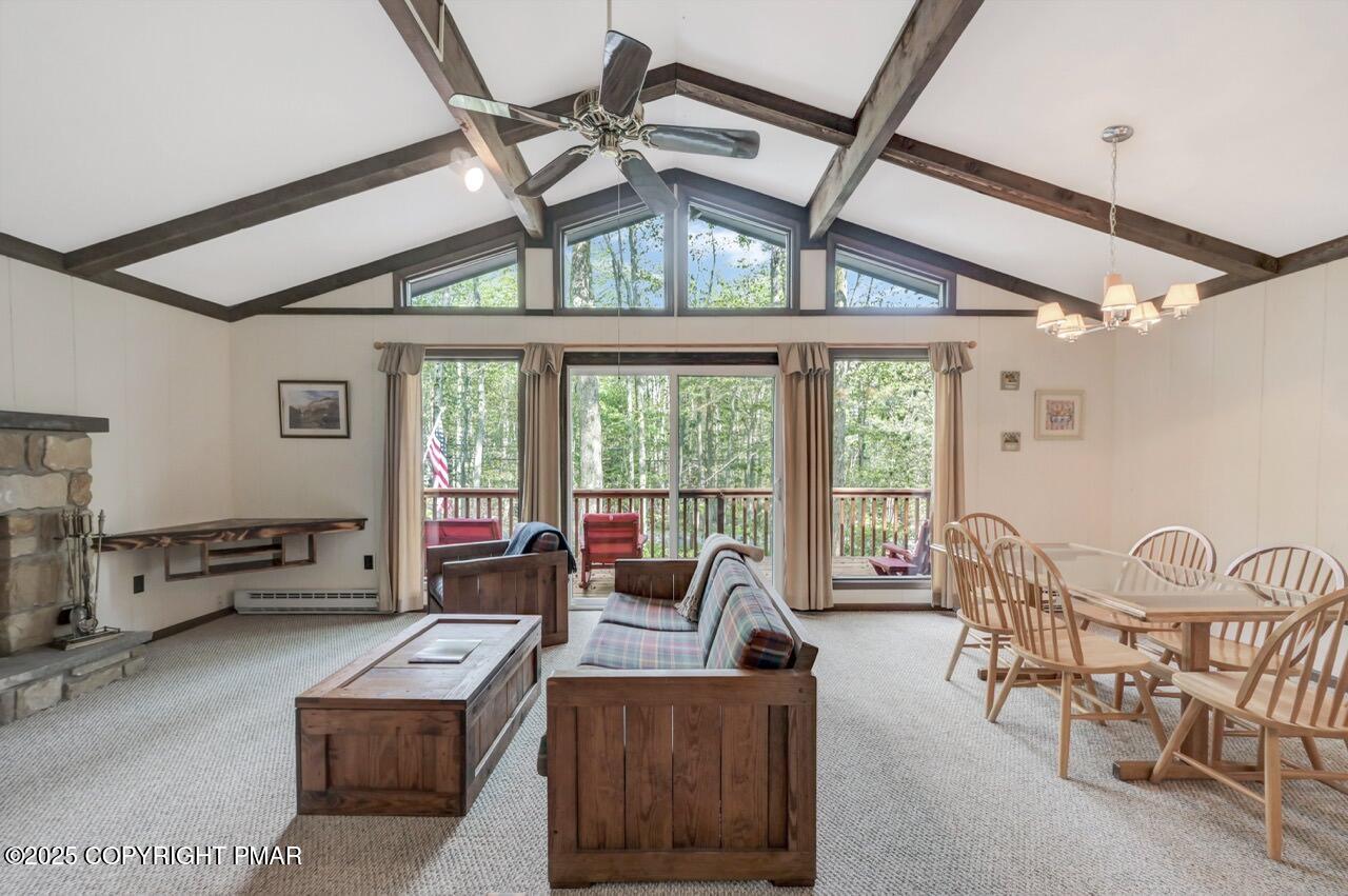 117 Winding Hill Road Pocono Pines, PA 18350 - Photo 5 of 19 a living room with furniture and a large window