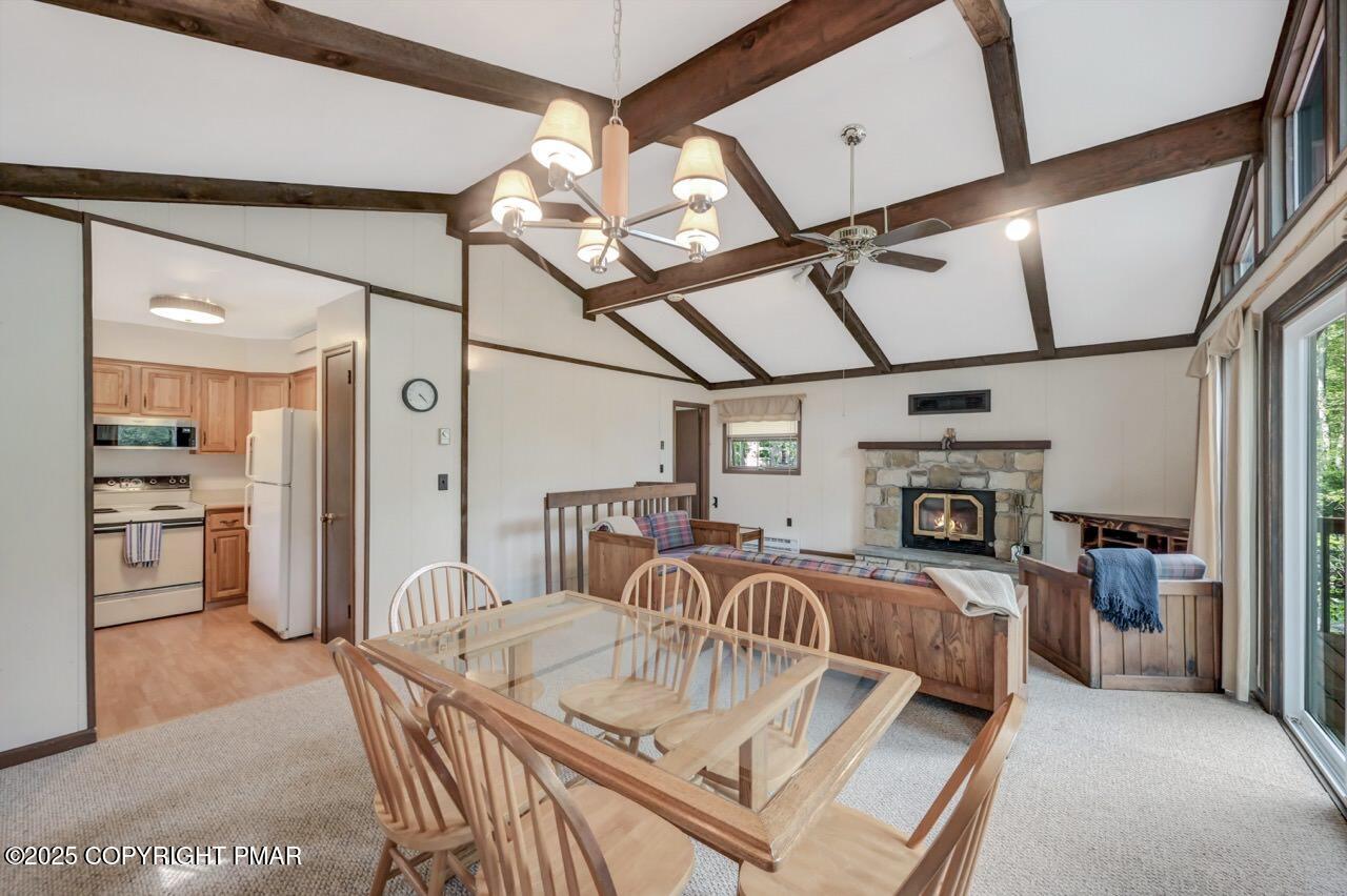 117 Winding Hill Road Pocono Pines, PA 18350 - Photo 6 of 19 a living room with furniture a flat screen tv and a chandelier