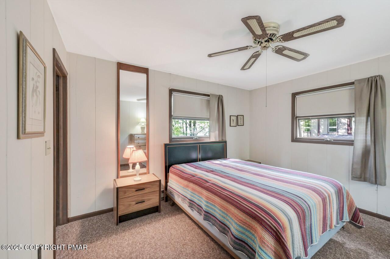 117 Winding Hill Road Pocono Pines, PA 18350 - Photo 9 of 19 a bedroom with a bed and a window